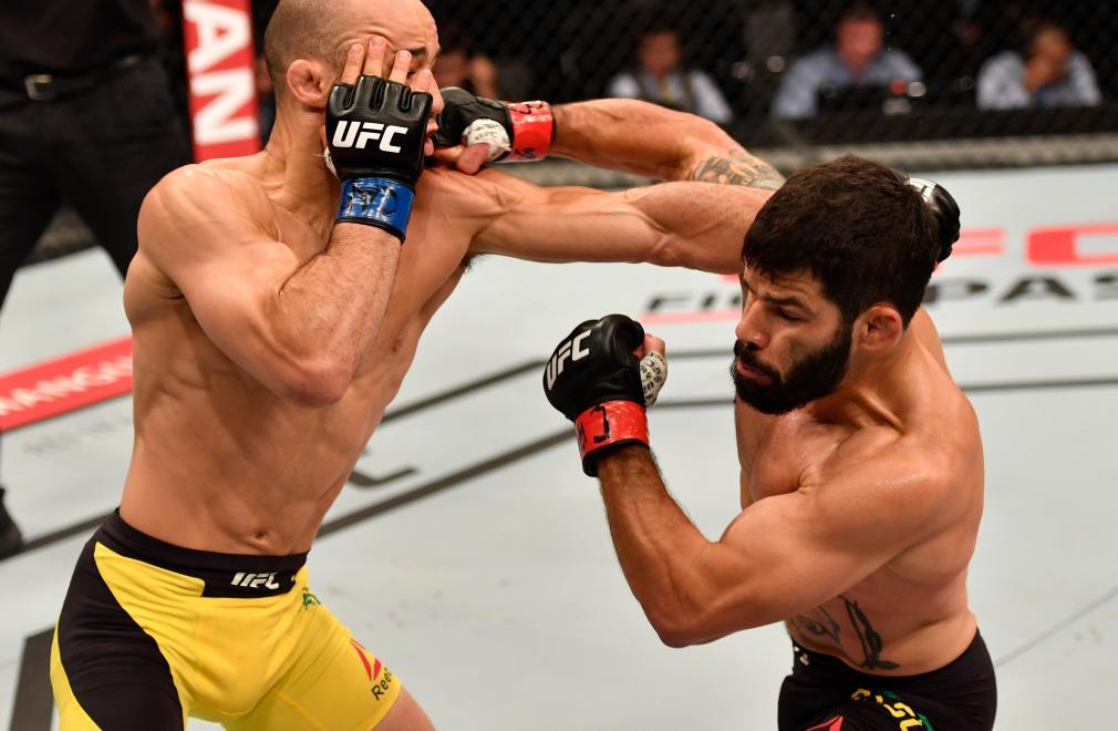 RIO DE JANEIRO, BRAZIL - JUNE 03: (R-L) Raphael Assuncao of Brazil punches Marlon Moraes in their bantamweight bout during the UFC 212 event at Jeunesse Arena on June 3, 2017 in Rio de Janeiro, Brazil. (Photo by Jeff Bottari/Zuffa LLC/Zuffa LLC via Getty Images)