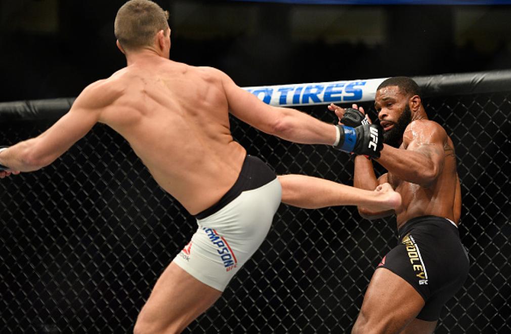 LAS VEGAS, NV - MARCH 04: (L-R) Stephen Thompson kicks Tyron Woodley in their UFC welterweight championship bout during the UFC 209 event at T-Mobile Arena on March 4, 2017 in Las Vegas, Nevada. (Photo by Jeff Bottari/Zuffa LLC/Zuffa LLC via Getty Images